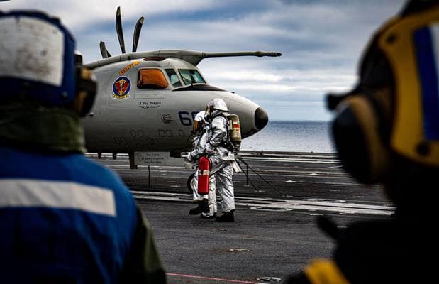 Sailors conduct firefighting training during a mass casualty drill on the flight deck of the aircraft carrier USS Nimitz (CVN 68) in the Pacific Ocean.