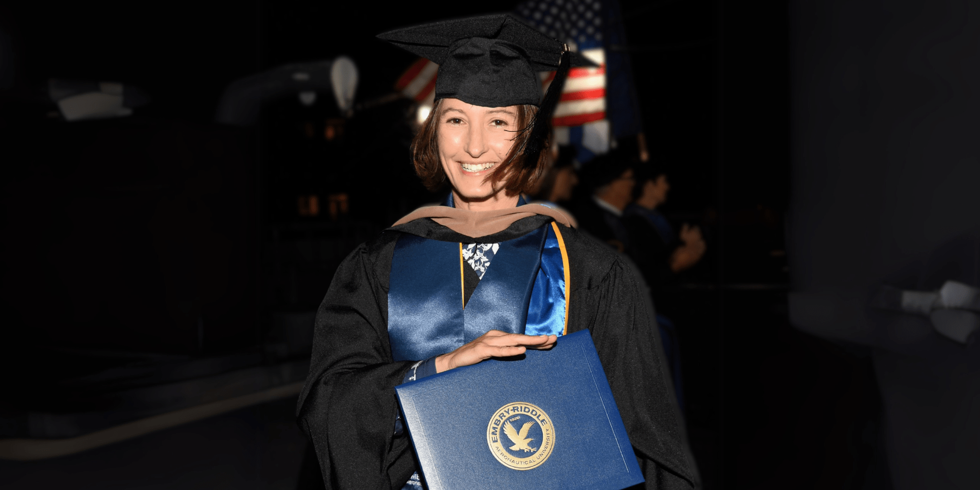 Andrea accepting her diploma