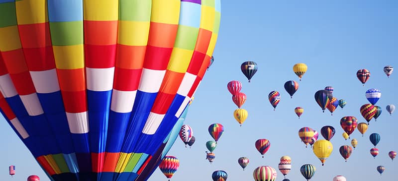 This is a photo of hot air balloons in the sky. 