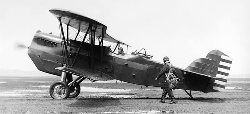 This is a photo of aviator Glenn Curtiss with his biplane.