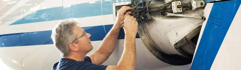 a mechanic working on an aircraft
