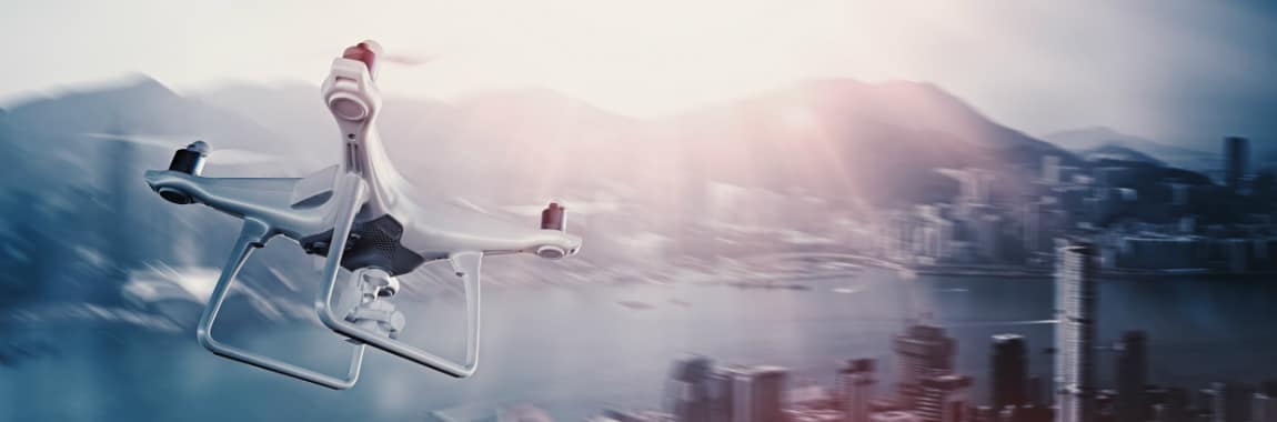 drone in flight over a city