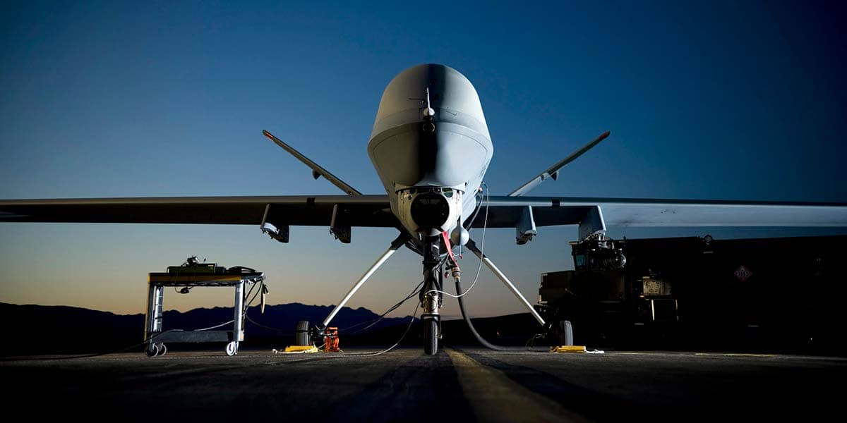 General Atomics Aeronautical Systems contractors refuel a MQ-9 Reaper at Creech Air Force Base, Nevada