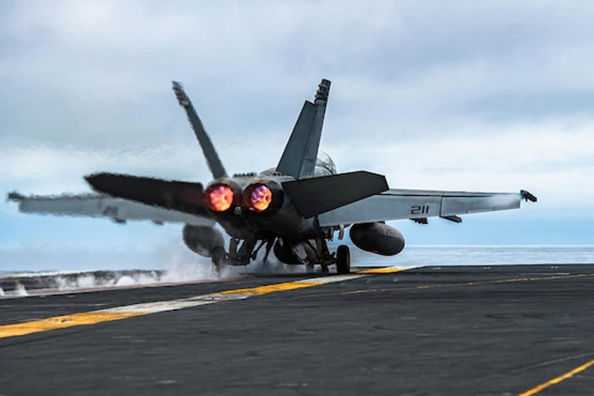 Fighter jet taking off from naval vessel