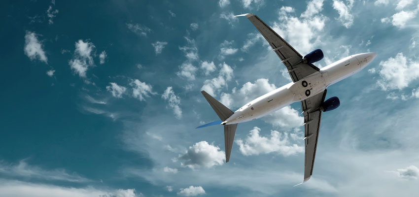 Aviation Cybersecurity Commercial Airliner flies through the sky