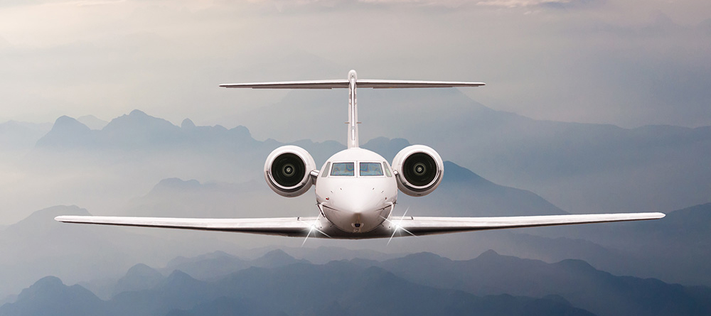 Private jet flies through clouds